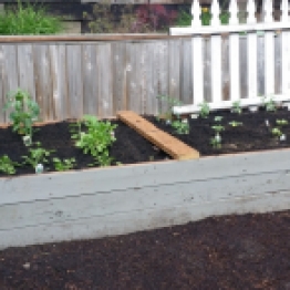 Made from the wood of the old deck. Nothing going to waste. Shoveled 2 1/2 yards of good soil but didn't need it all.