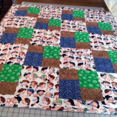 Funny faces on a not so pretty quilt